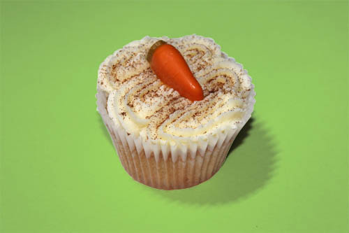 Traditional carrot cake in cupcake form. Made with real carrots, raisins, nuts and spices, topped with cream cheese frosting